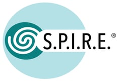 A logo with a turquoise oval shape on the left, featuring a spiral design inside. The word SPIRE appears to the right in black lowercase letters with periods between each letter (S.P.I.R.E.).
